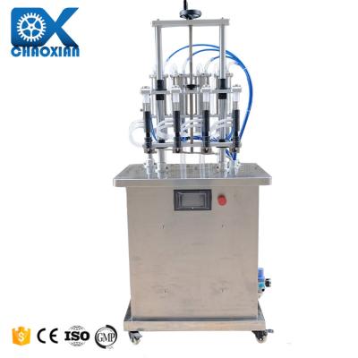 China Semi Automatic 4 Head Nozzle Vacuum Equal Liquid Level Glass Bottle Perfume Filling Machine Filler for sale