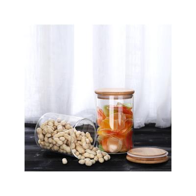 China Alternative Heat And Cold Without Cracking Cheap Airtight Circular Food Grade Containers Glass Storage Jars With Wooden Top Lid for sale