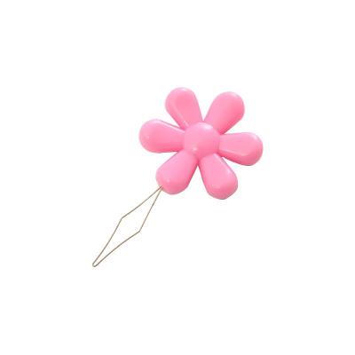 China Color Useful Multifunctional Hand Flower Shape Threader Plastic Sewing Needle for sale