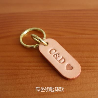 China Sales of unisex real leather car key chain key chain men and women leather bracelet available for sale