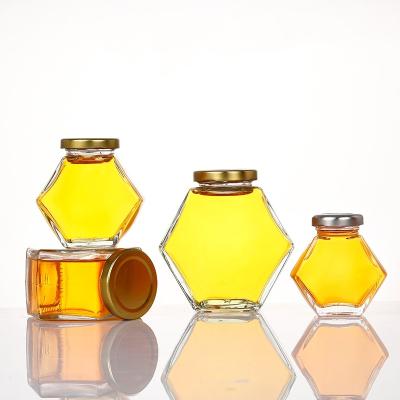 China Wholesale Grain Storage Hexagon Glass Container Storage Bottle With Metal Lid Honey Jar Food Storage Bottle Glass for sale