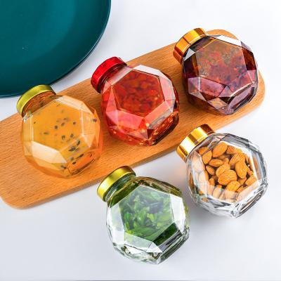 China Wholesale Mini Bee Hexagon Unique Honey Jar Food Storage Label Fancy Hexagon Tinplate Lid Packaging Glass Bottle for sale