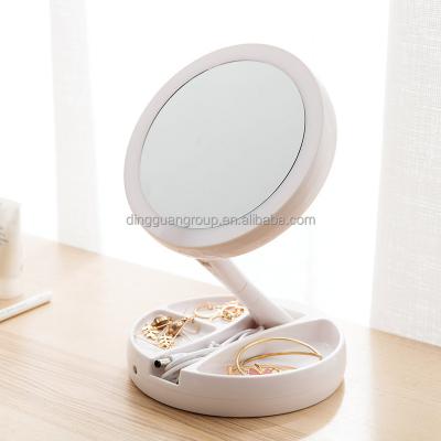 China New Minimalist Double Sided LED Circular Folding Mirror Socket Desktop Storage Make Up Mirror With Light for sale