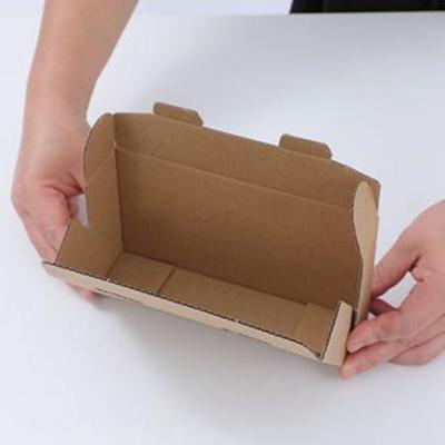 China Recycled Materials Fast Delivery Flute Flat Folding Kraft Cardboard Mailing Paper Boxes for sale