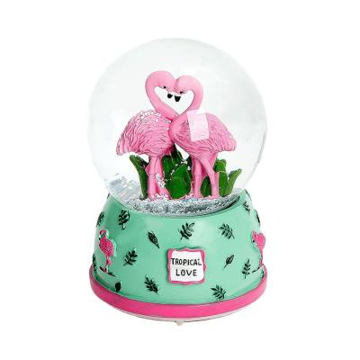 China Series 80mm Artificial Pink Flamingo Gifts House Ornaments Resin Crafts Snow Globe Snowball for sale