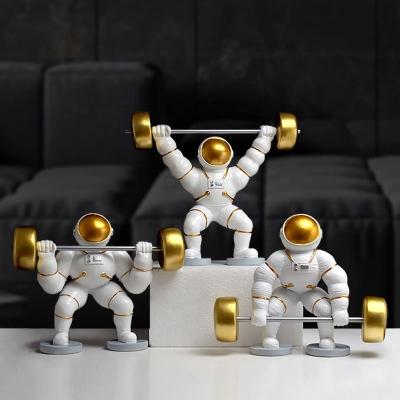 China Office Astronaut Weightlifting Europe Office Nordic Creative Living Room Decor Resin Figurine for sale