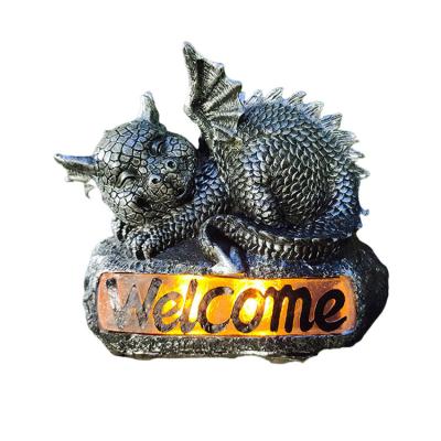 China Nordic Creative Resin Dinosaur Outdoor Decor Villa Garden Welcome Sign Europe Style Solar Light for sale