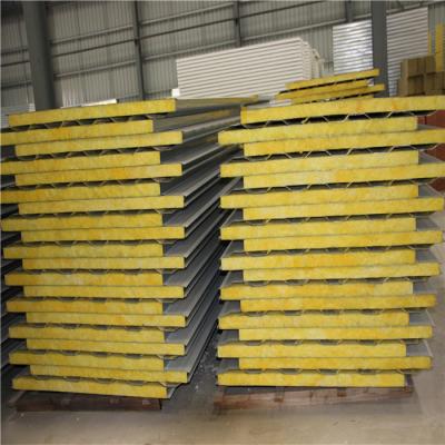 China 1150-50-0.6mm galvanized steel up and 0.326mm geywhite down glass wool sandwich panel for sale