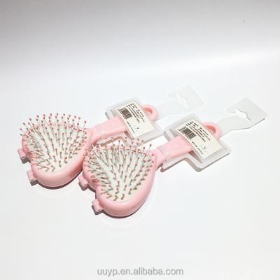 China Portable Cute Curly Hair Detangler Brush Pink Curly Hair Detangling Paddle Daily Use Twist Hair Comb for sale