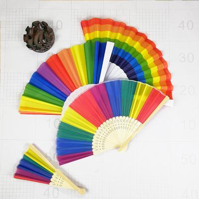 China China Promotional Various Kinds Like Rushing Stock Delivery Big Rainbow Colors Decorative Hand Held Folding Fans for sale