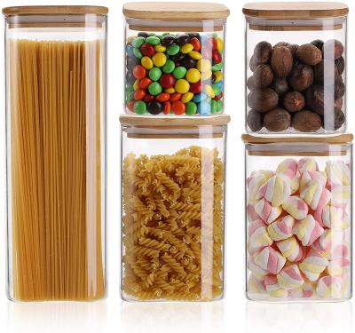 China Heatable Square Borosilicate Glass Canister with Sealed Bamboo Lids Air Tight Glass Storage Canister and Stackable Clear Glass Jar Set 5 for sale