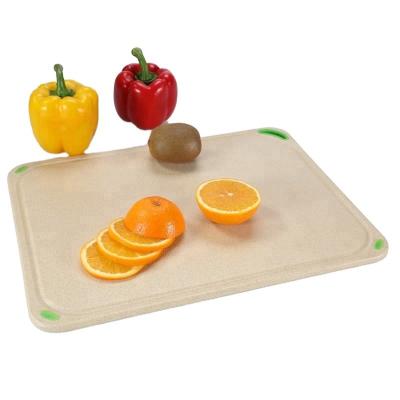 China Tabla de corte de pan de cáscara de arroz con ranura para frutas y verduras en venta