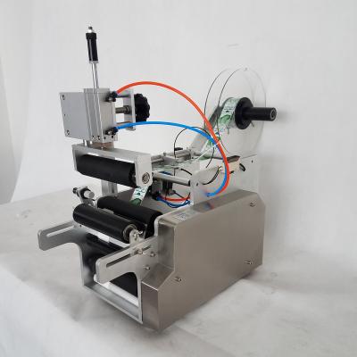 China food round bottle labeling machine/new design semi automatic adhesive round bottle for glass plastic labeling machine for sale