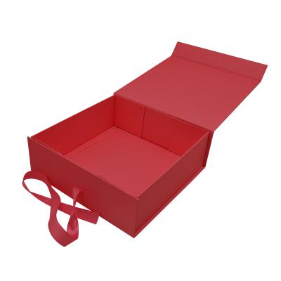 China Biodegradable stock standard red square middle folding magnetic gift boxes with ribbon in hot sale for sale