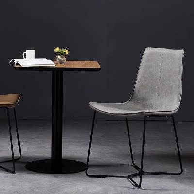 China Retro Nordic Home Cooling Furniture Vintage PU Leather Dining Chair With Black Painted Legs for sale