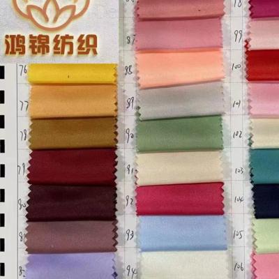 China Stretch Spot Dyed Stock Fabric A Top Quality Grade Polyester Large Quantity Woven for sale