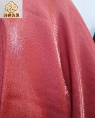 China New Trend Organic Polyester Metallic Shiny 100% Plain Dyed For Garment Stock Fabric for sale