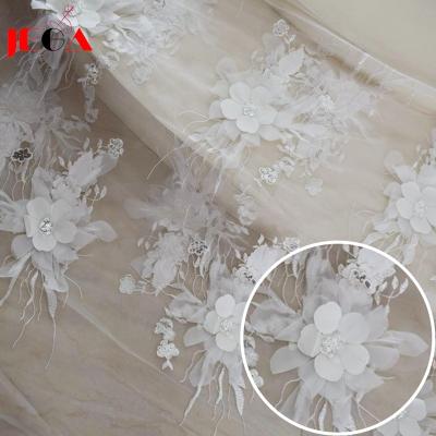 China 2020 Sustainable White Bridal Dress Embroidery Lace Fabric Wedding Tulle Material for sale