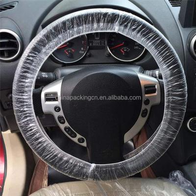 China Perfectly fitting plastic cover devices keep disposable PE universal steering wheel cover clean for sale