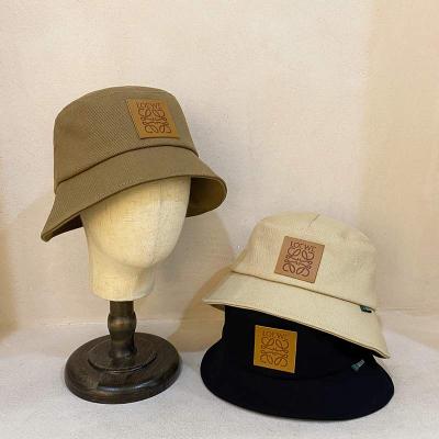 China Hot Sale Striped PU Leather Bucket Hat With Leather Patch Custom Wholesale Fishing Hat For Man And Woman for sale