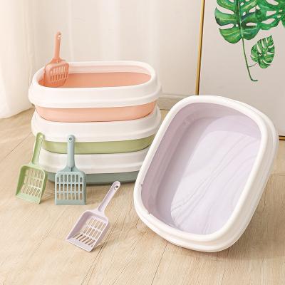 China Sustainable wholesale pet cat supplies litter box large removable high edge litter box semi-enclosed cat toilet for sale