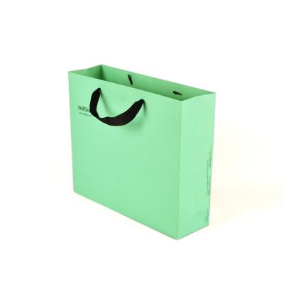 China Recycled Materials Printed logo Paper Bag Custom Luxury Clothing Shopping Paper Bags Boutique Recyclable Gift Bag With Ribbon rope for sale