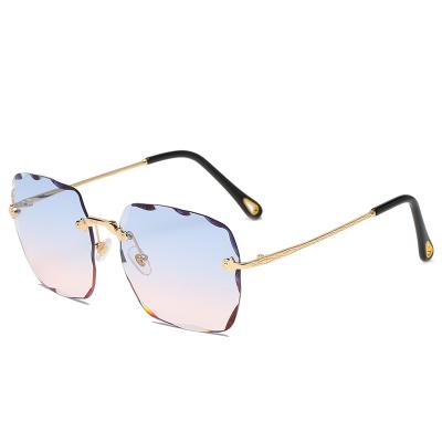 China New Fashional Sunglasses Newest Style Square Cut Lens Rimless Designer Female Fashion Sunglasses Women Sunglasses for sale