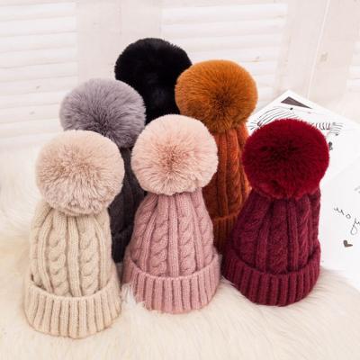 China Winter Women Girls Hat Wool Cap Rolled Edges Outdoor Windproof Ear Production Warm Knit Cap for sale