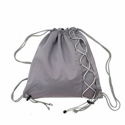 China Outdoor Drawstring Waterproof Reflective Nylon Packing String Bag Fashion Sports Drawstring Bag Dual-Use Backpack for sale