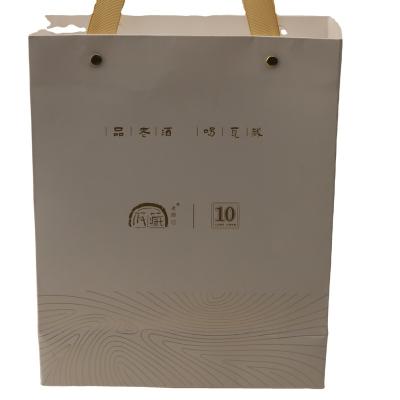 China Recycled Materials Eco Friendly Luxury Cardboard Custom Size Recyclable Newest Design Popular Embossing Gold Foil Stamping Shopping Kraft Paper Bag for sale