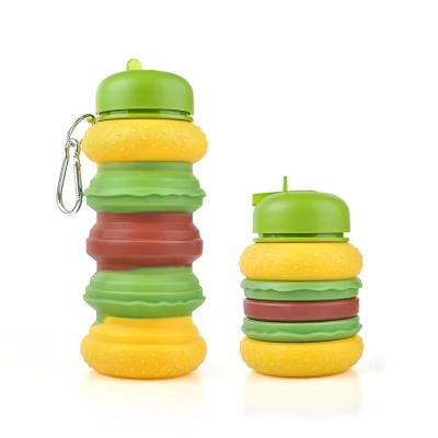 Cina Donut bottiglia d'acqua pieghevole per bambini 19oz BPA senza perdite Silicone Rainbow bottiglie d'acqua per studenti in vendita