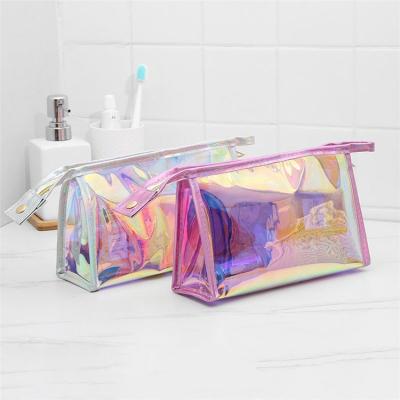 China Custom Stand Up Pouch Waterproof With Silver Zipper Edge Skin Care Travel Bag Holographic PVC Heat Seal Bag for sale