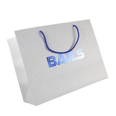 China Eco Friendly Horizontal Logo White Paper Shopping Hot Blue Stamping Bag With Handle for sale