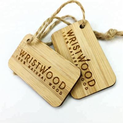 China Sustainable Wholesale Custom Bamboo Wooden Hang Tag With Engraved Logo For Apparel for sale