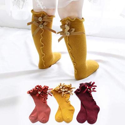 China Fashion Antibacterial Uron Bow Princess Baby High Knee Socks Stain Children Socks Stockings en venta