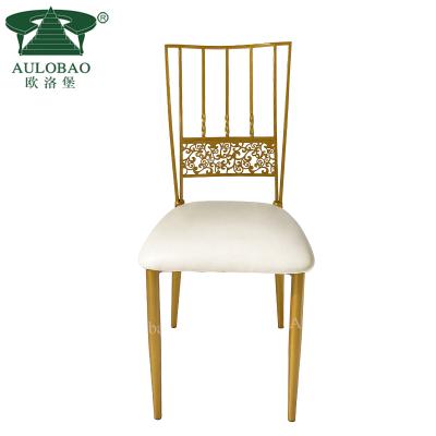 China Modern Wholesale Stackable Back Throne Gold Hollow Iron Dining Chairs For Events for sale