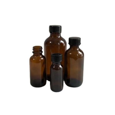 China Personal Care 2oz 4oz 8oz 16oz Vanilla Extract Amber Bottle Boston Round Glass Bottle Pharmaceutical Black Phenolic Screw Cap for sale