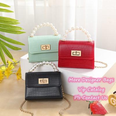 China Fashion bag bolsas mini mujer cute handbags bags cheap pvc cosmetic bag bulk wholesale handbags freeze purse coin purse pearl bag for sale