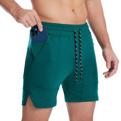 China New men's five-point shorts 2022 summer QUICK-DRY running multi-pocket fitness leisure sports solid color knitted thin shorts for sale