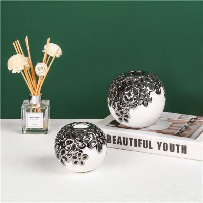 China Europe ball shape hotel wedding decorative pieces decoration silver plating ceramic tealight home candle holder for sale