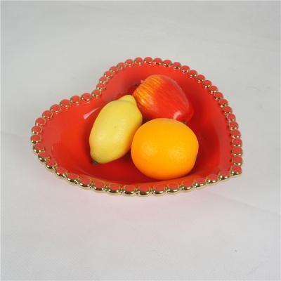 China Sustainable Modern European Style Point Embossed Ceramic Fruit Bowl Decorated Edge Heart Shape for sale