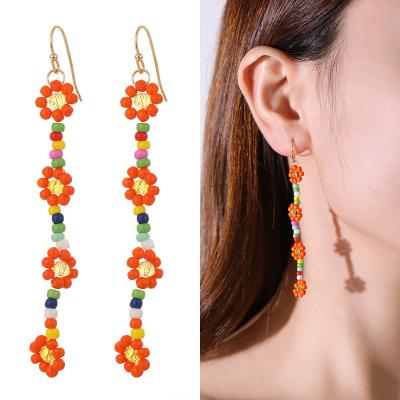 China 2022 TRENDY Daisy Flower Long Dangling Earring Beaded By Cute Handmade Rice For Girls Colorful Minimalism Drop Beaded Earrings Wholesale for sale