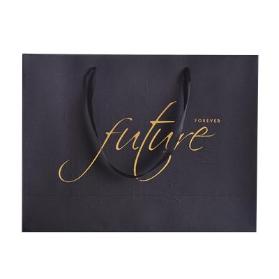 China New Handmade Logo Cotton Rope Handles Hot Foiled Stamping Black Matt Kraft Paper Bag With Golden for sale