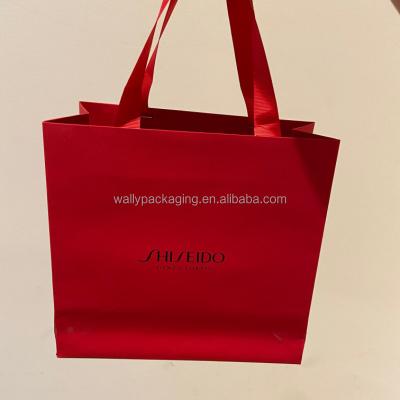 China Recycled Materials Custom Luxury cosmetic Store Retail Packaging Gift Carry Bags Boutique Shopping Paper Bags With Your Own Logo for sale