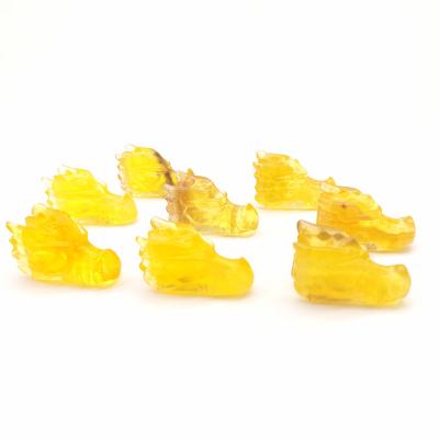 China Europe Crystal Folk Crafts Natural 2 Inch Hand Carving Fluorite Yellow Dragon Skull Sculpture For Home Decoration Healing Stone for sale