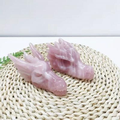 China Europe Customized Natural Crystals Carving Crafts Animal Folk Art Dragon Skulls Rose Quartz Dragon Head for sale