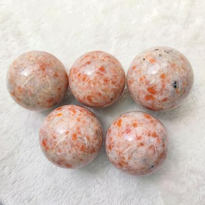 China Europe Natural Healing Stone Sun Crystal Sphere Folk Crafts 60MM Stone Ball Polished Gemstone For Home Decoration for sale