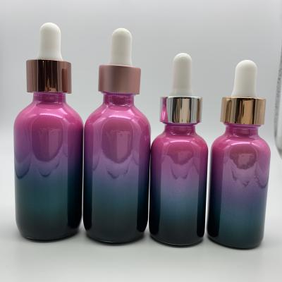 China Fancy Gradient Plated Plate Fading Color Boston Round Bottle Essential Oil Bottle With Glass Dropper Cap for sale