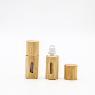 China Small cosmetic high quality luxury wooden shell roller glass vial made in China for sale