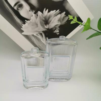 China Hot Selling Cosmetic Stripe Perfume Bottles Glass Spray Glass Bottle for sale